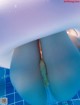 A close up of a person's butt in a swimming pool.