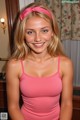 A woman in a pink tank top posing for a picture.