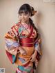 A woman in a kimono posing for a picture.